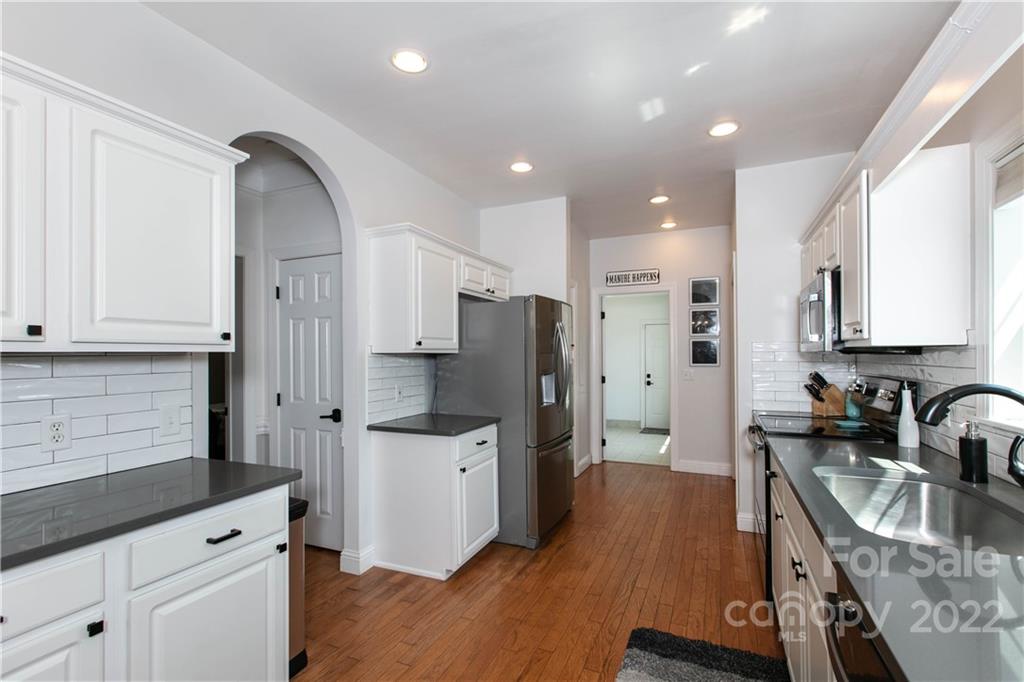 991 Golf Course Road Tryon, NC 28782 - Photo 36 of 43 a kitchen with stainless steel appliances sink refrigerator and cabinets