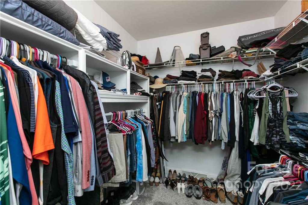 991 Golf Course Road Tryon, NC 28782 - Photo 40 of 43 a view of walk in closet with clothes
