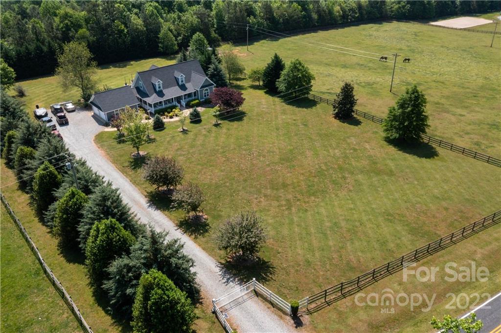 991 Golf Course Road Tryon, NC 28782 - Photo 42 of 43 an aerial view of a house with a yard