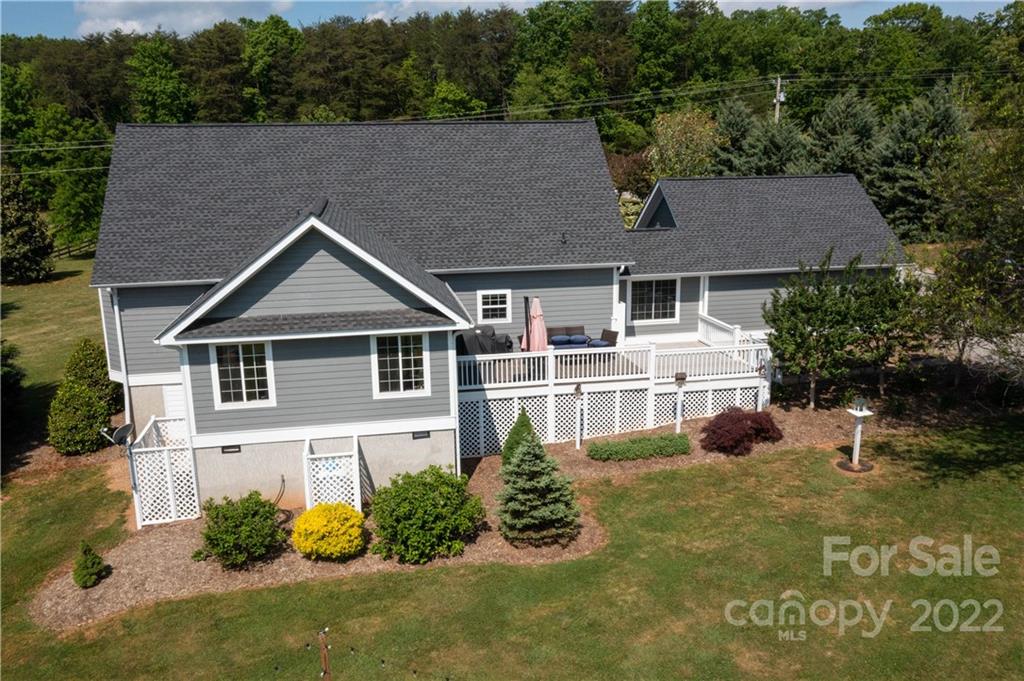 991 Golf Course Road Tryon, NC 28782 - Photo 6 of 43 a front view of a house with a yard