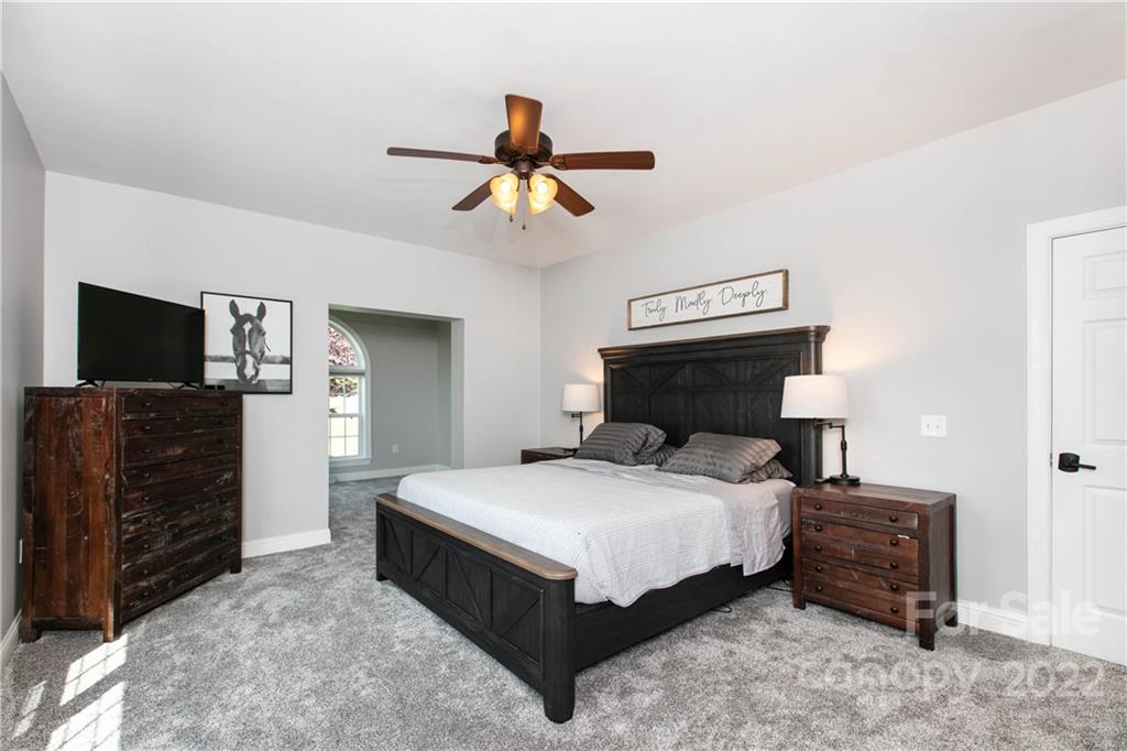 991 Golf Course Road Tryon, NC 28782 - Photo 10 of 43 a bedroom with a bed and a television