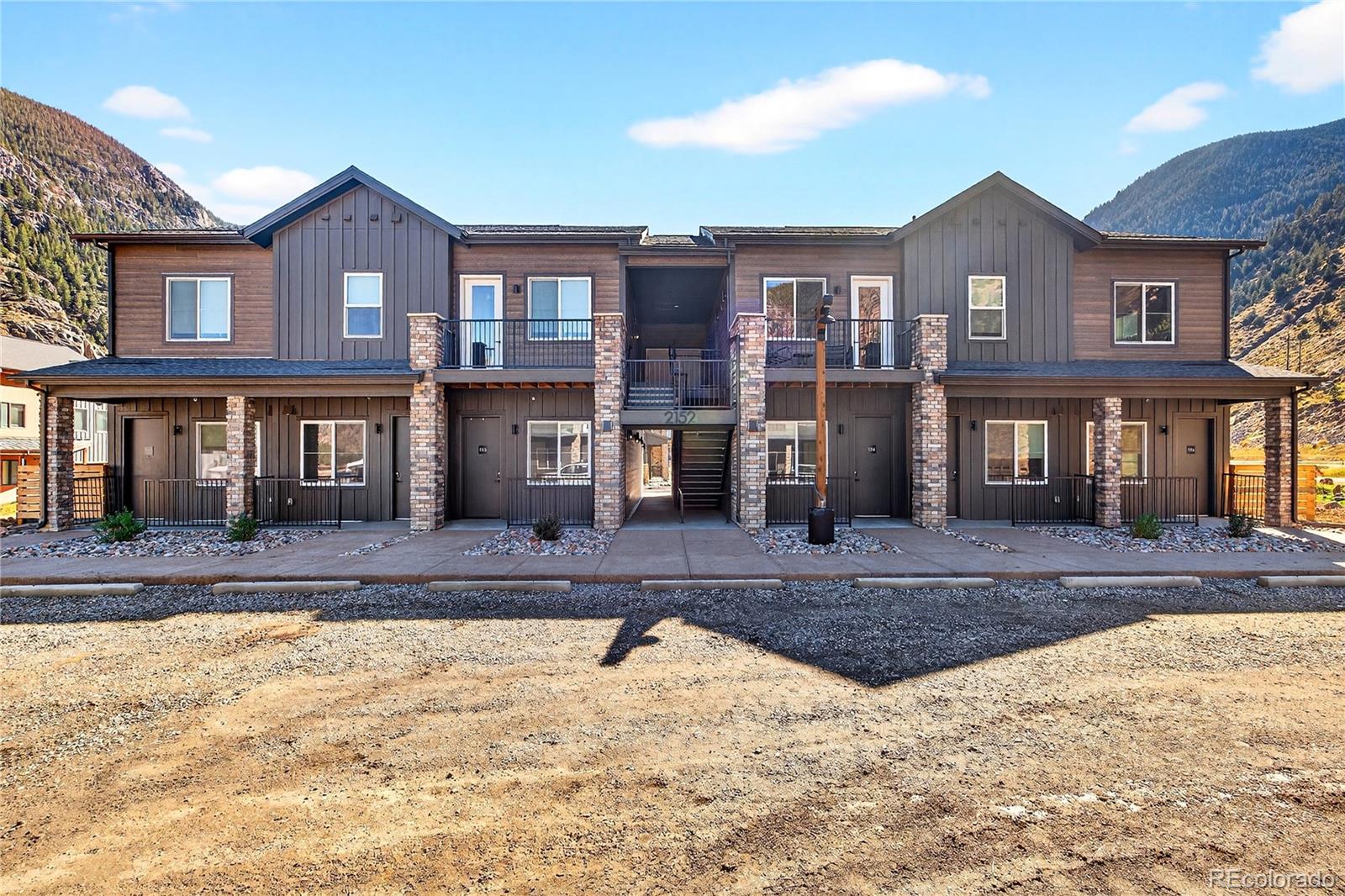 2155 Bighorn Road, Unit 201 Georgetown, CO 80444 - Photo 14 of 35 a view of a brick house with a swimming pool