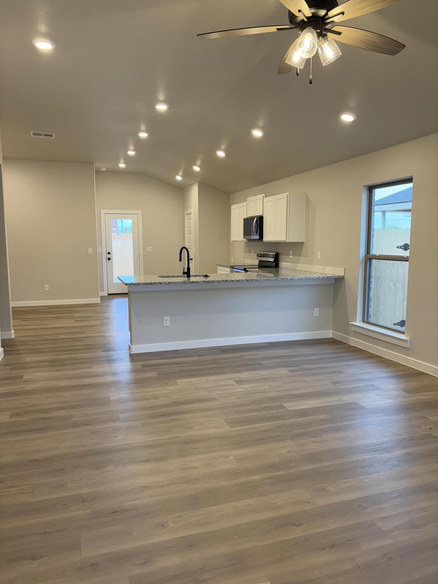 7222 35th Street Lubbock, TX 79407 - Photo 2 of 11 a view of kitchen and windows