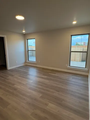 a bathroom with a bathtub and a toilet