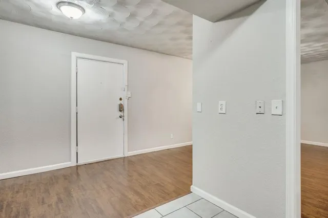 an empty room with wooden floor