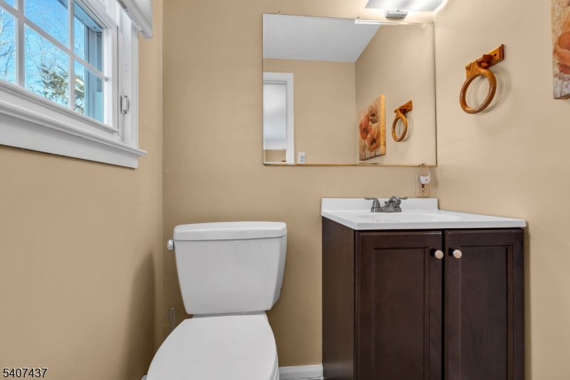 9 Corsica Road Hopatcong, NJ 07843 - Photo 11 of 33 a bathroom with a toilet sink and mirror