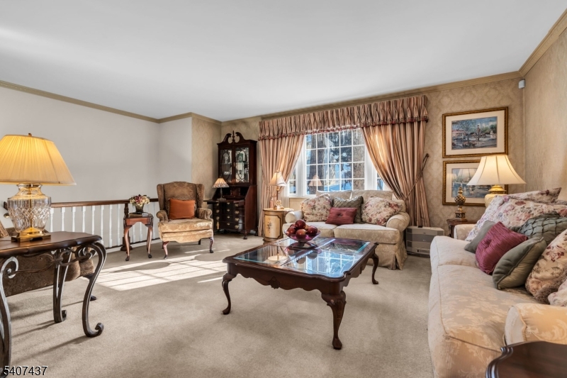 9 Corsica Road Hopatcong, NJ 07843 - Photo 14 of 33 a living room with furniture and a large window