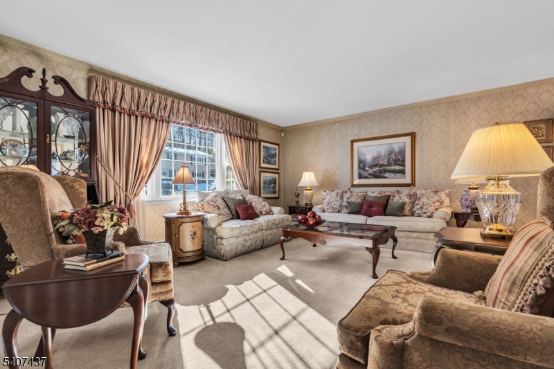 9 Corsica Road Hopatcong, NJ 07843 - Photo 15 of 33 a living room with furniture and a large window