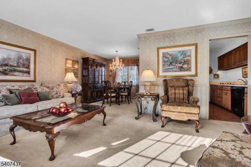 9 Corsica Road Hopatcong, NJ 07843 - Photo 16 of 33 a living room with furniture and a flat screen tv