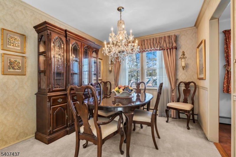 9 Corsica Road Hopatcong, NJ 07843 - Photo 17 of 33 a view of a dining room with furniture and chandelier