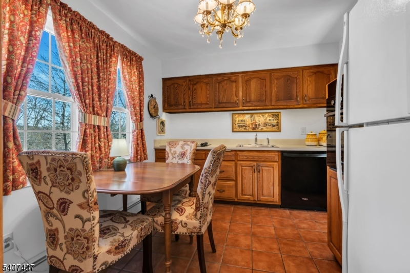 9 Corsica Road Hopatcong, NJ 07843 - Photo 18 of 33 a kitchen with a table and chairs