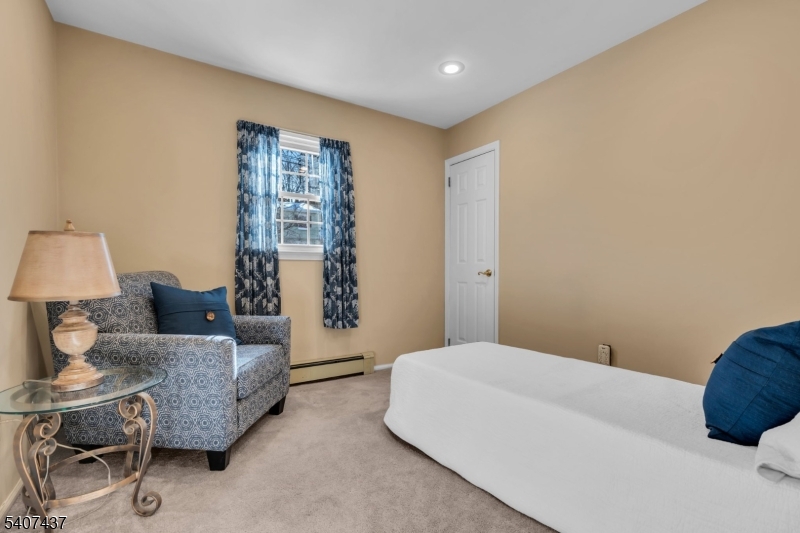 9 Corsica Road Hopatcong, NJ 07843 - Photo 20 of 33 a bedroom with a bed and a couch