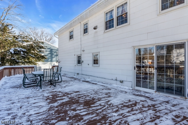 9 Corsica Road Hopatcong, NJ 07843 - Photo 25 of 33 a backyard of a house with yard and outdoor seating
