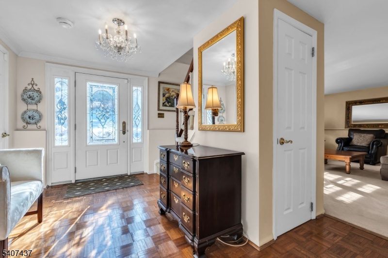 9 Corsica Road Hopatcong, NJ 07843 - Photo 5 of 33 a view of a hallway with wooden floor and workspace
