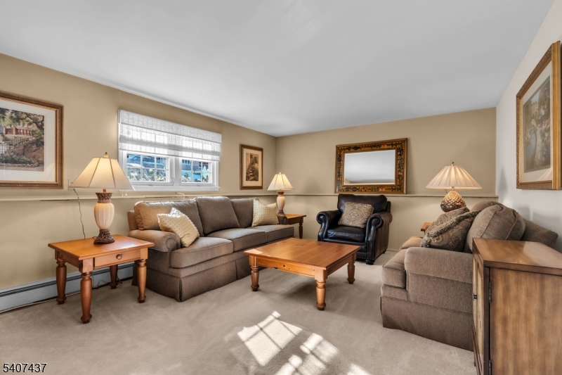 9 Corsica Road Hopatcong, NJ 07843 - Photo 6 of 33 a living room with furniture and a large window