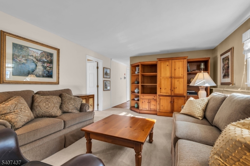 9 Corsica Road Hopatcong, NJ 07843 - Photo 7 of 33 a living room with furniture and a window