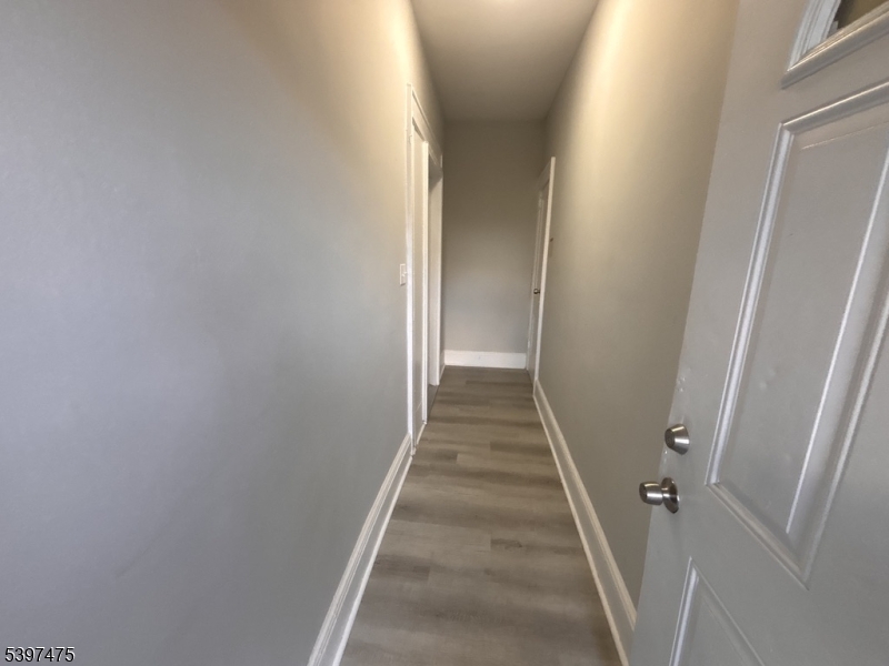 237 Fulton Street Paterson, NJ 07501 - Photo 2 of 11 a view of a hallway with a white door