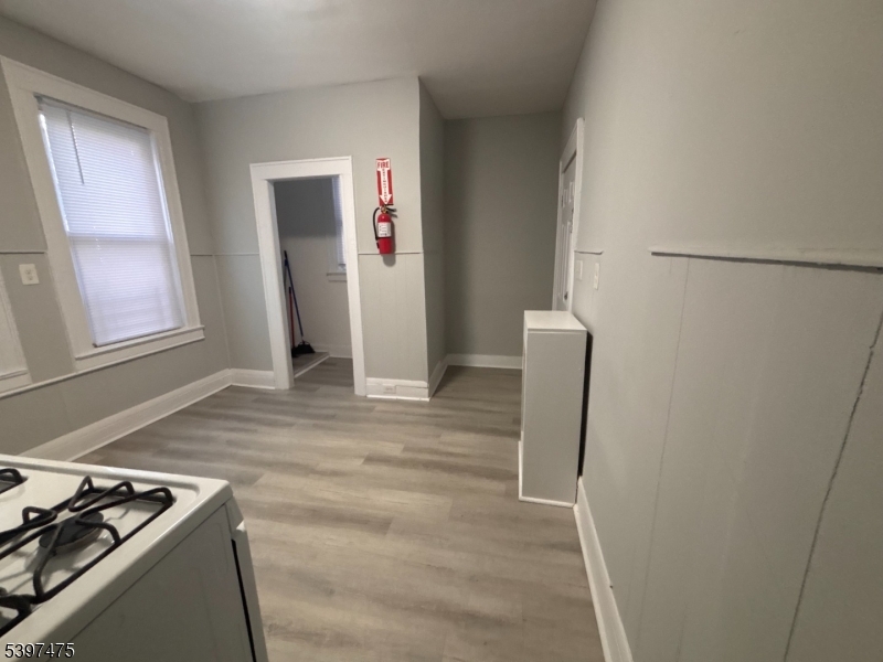 237 Fulton Street Paterson, NJ 07501 - Photo 6 of 11 a view of room with window and refrigerator