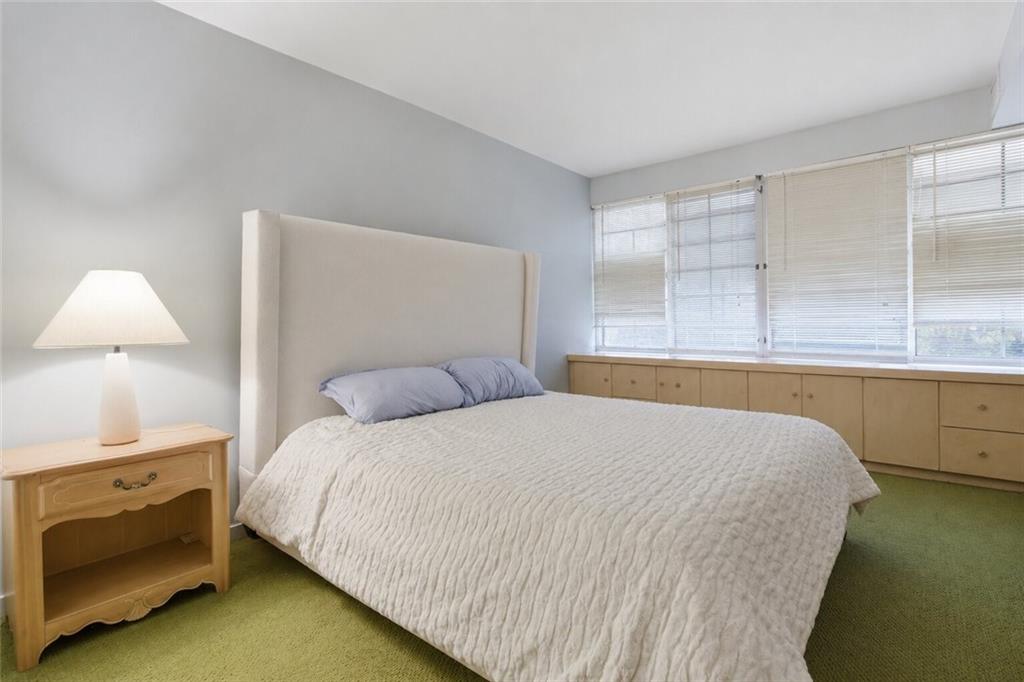 750 Washington Road, Unit 307 Pittsburgh, PA 15228 - Photo 13 of 24 a bedroom with a bed and a night stand