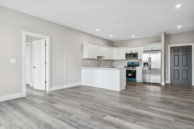 a view of kitchen with wooden floor