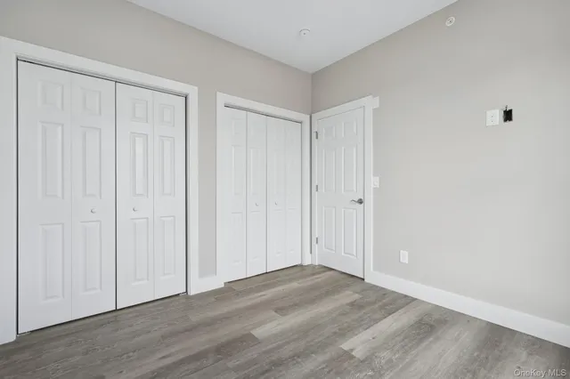 a view of a livingroom with wooden floor