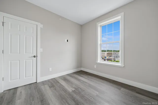 a view of a livingroom with wooden floor