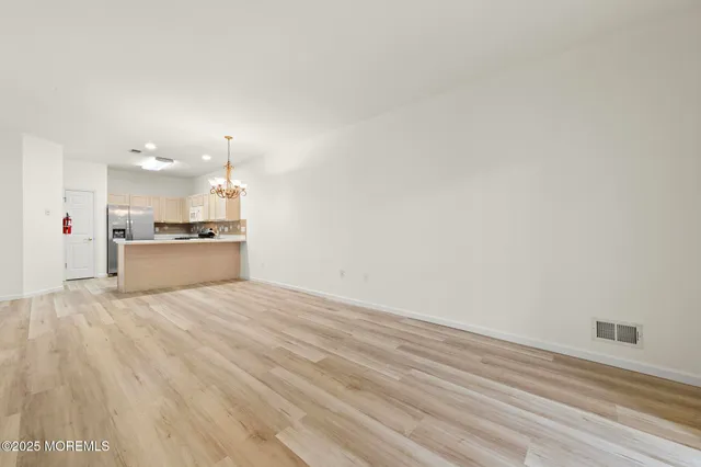 a view of a kitchen with a sink and a dishwasher