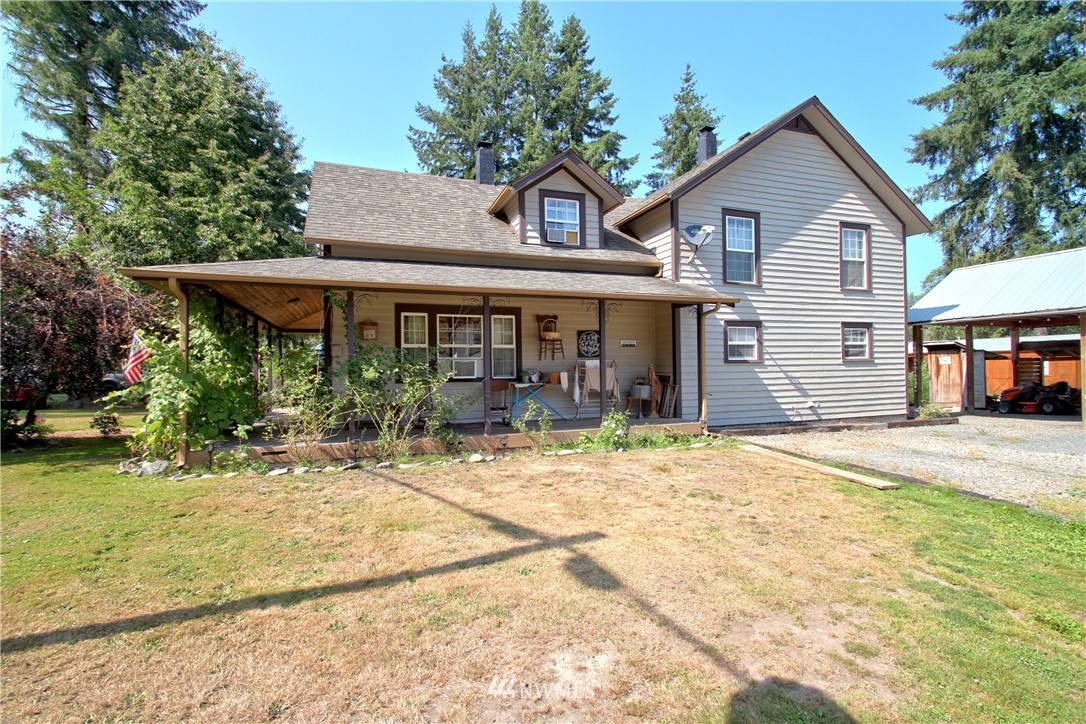 30217 Oso Loop Road Arlington, WA 98223 - Photo 1 of 34 a front view of a house with a porch