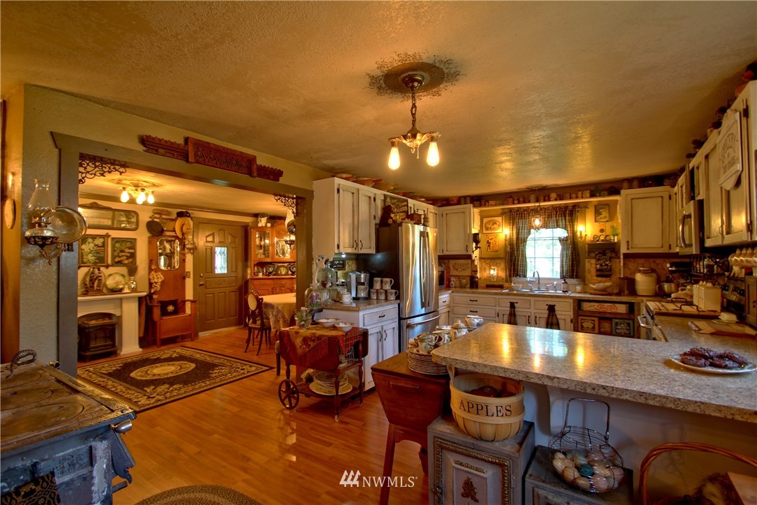30217 Oso Loop Road Arlington, WA 98223 - Photo 19 of 34 a room with lots of furniture and chandelier
