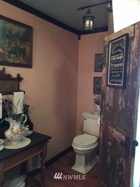 30217 Oso Loop Road Arlington, WA 98223 - Photo 23 of 34 a white toilet sitting next to a bathroom sink