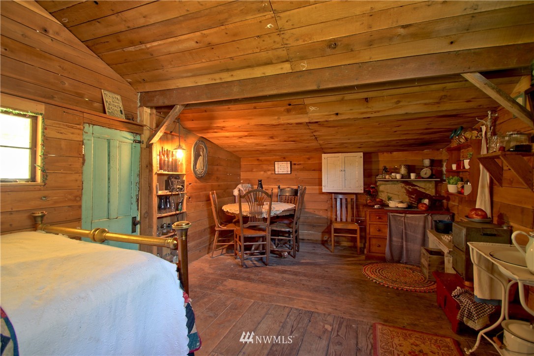 30217 Oso Loop Road Arlington, WA 98223 - Photo 9 of 34 a room with lots of wooden furniture and a view of bedroom