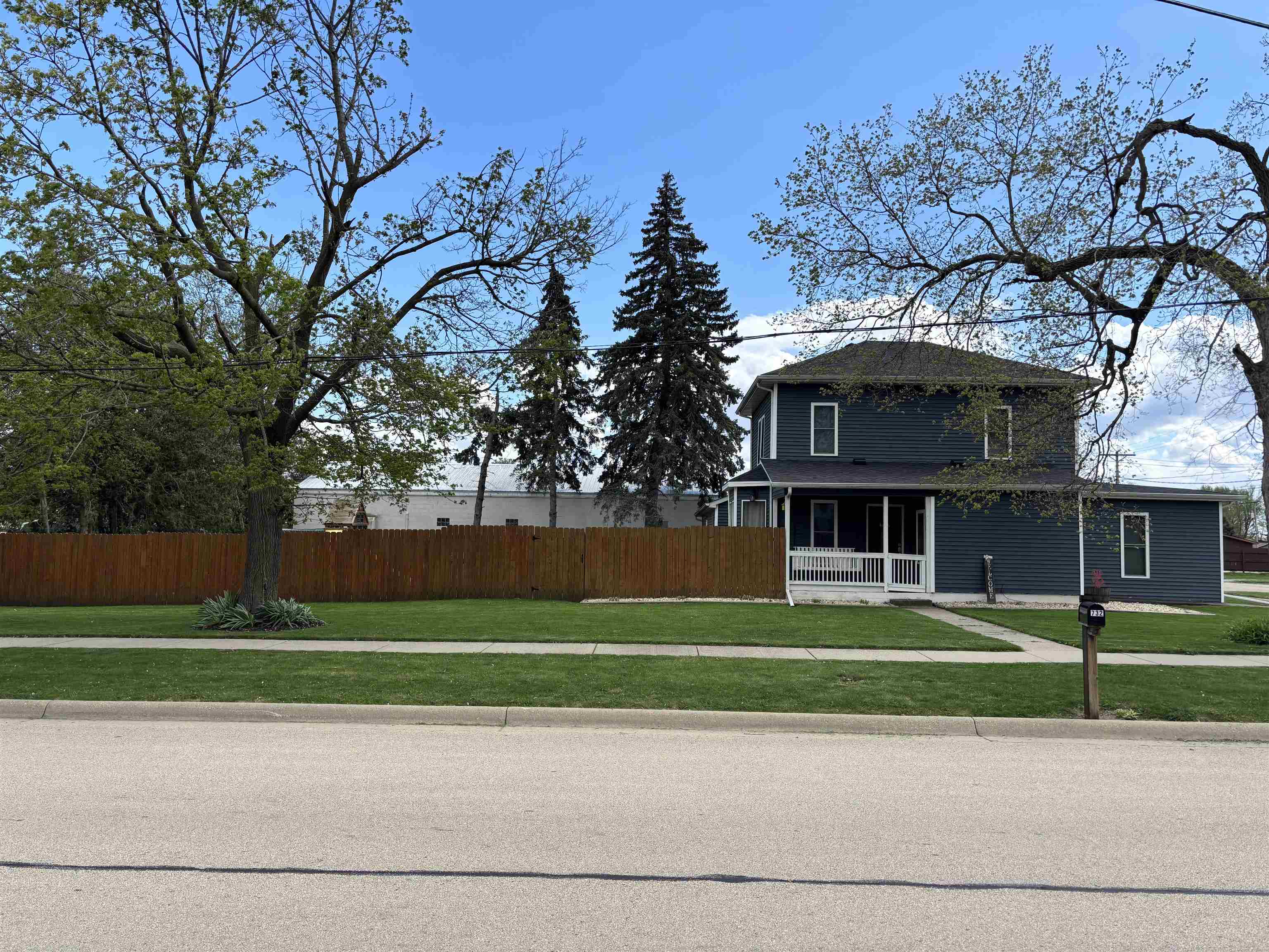 732 West 2nd Street Byron, IL 61010 - Photo 3 of 22 a view of a trees in front of a building