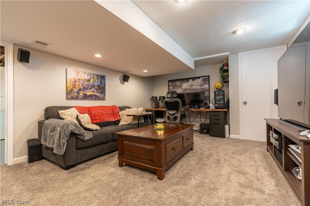 8320 Ackley Road Parma, OH 44129 - Photo 19 of 36 Living room featuring light carpet