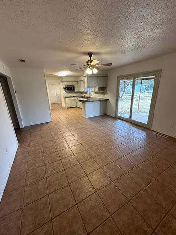 a view of a kitchen with furniture and a kitchen