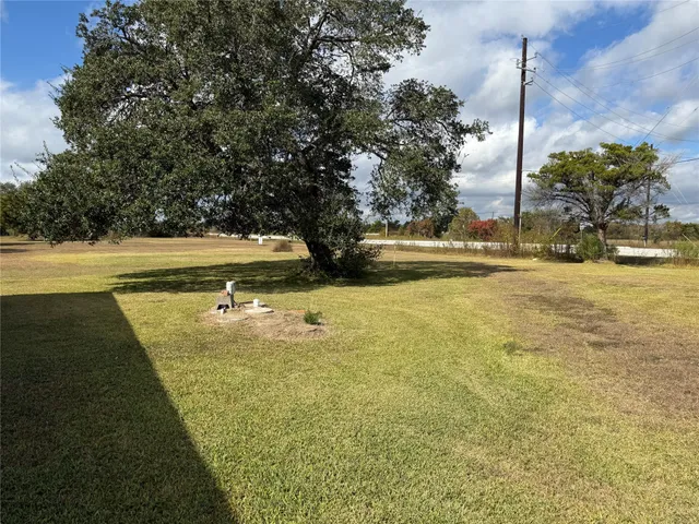 a view of an swimming pool with an outdoor space and seating area