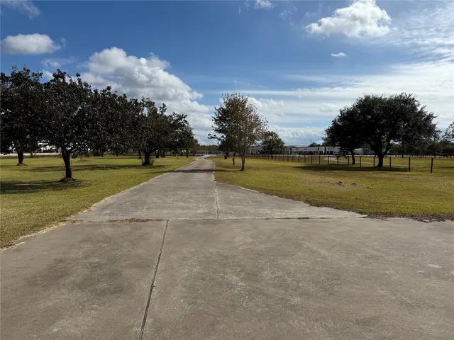 a view of an outdoor space and tennis court