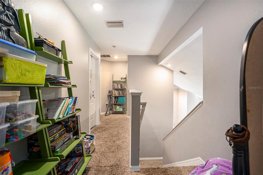 11808 Colony Lakes Boulevard New Port Richey, FL 34654 - Photo 17 of 25 a view of a hallway with workspace