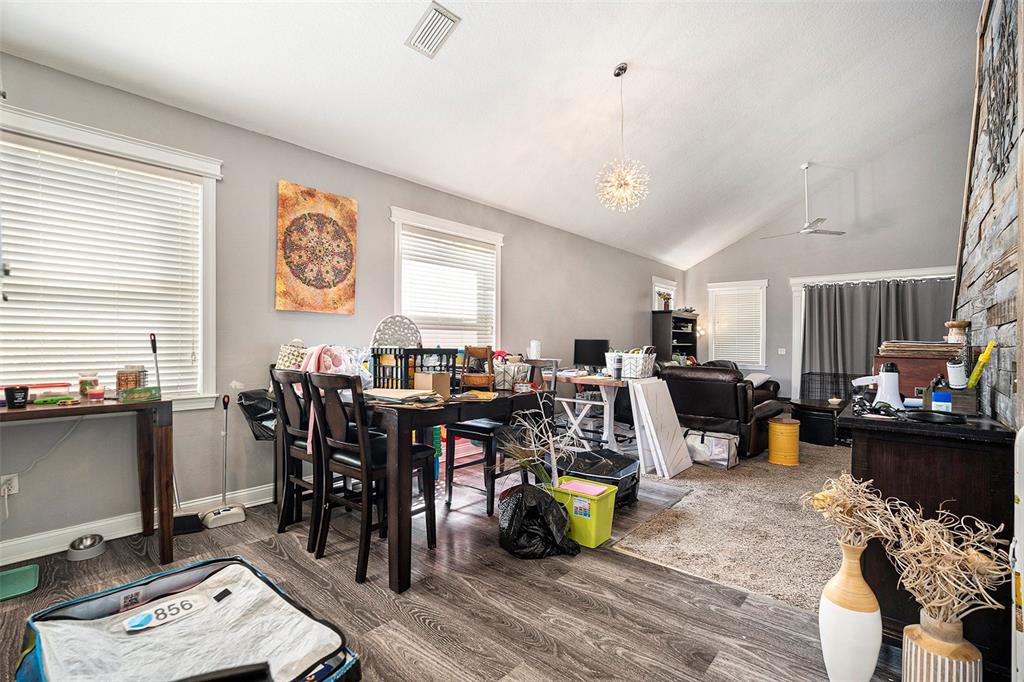 11808 Colony Lakes Boulevard New Port Richey, FL 34654 - Photo 4 of 25 a living room with lots of chairs and furniture