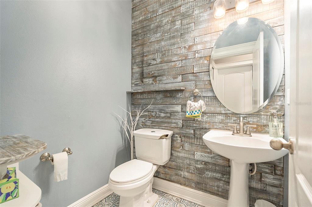 11808 Colony Lakes Boulevard New Port Richey, FL 34654 - Photo 10 of 25 a bathroom with a sink toilet and mirror