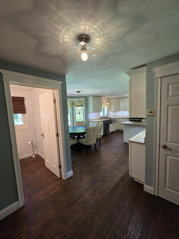 8 Caleb Road Shirley, MA 01464 - Photo 12 of 42 a kitchen with a refrigerator and a stove top oven