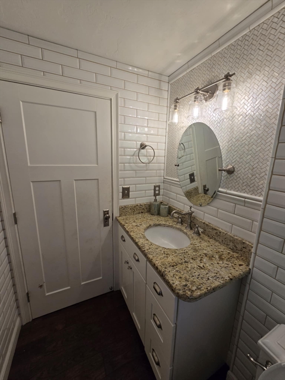 8 Caleb Road Shirley, MA 01464 - Photo 16 of 42 a bathroom with a granite countertop sink a mirror and shower