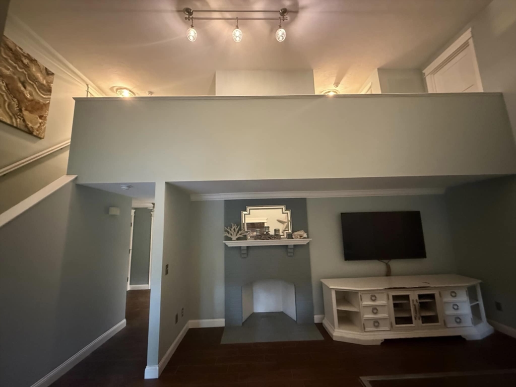 8 Caleb Road Shirley, MA 01464 - Photo 20 of 42 a living room with furniture and a flat screen tv