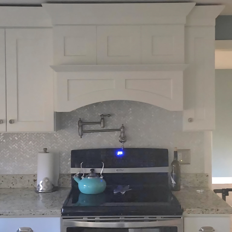 8 Caleb Road Shirley, MA 01464 - Photo 3 of 42 a kitchen with a stove and cabinets
