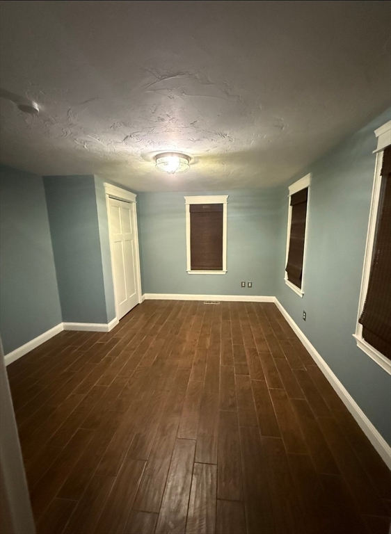 8 Caleb Road Shirley, MA 01464 - Photo 41 of 42 a view of empty room with wooden floor