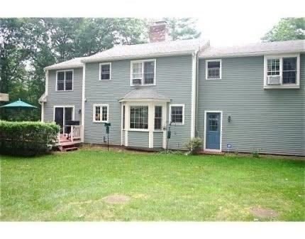8 Caleb Road Shirley, MA 01464 - Photo 42 of 42 a view of a house with a yard and sitting area