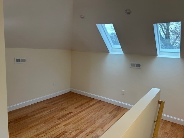 1599 Washington Street, Unit 2 Newton, MA 02465 - Photo 25 of 34 a view of wooden floor in a room