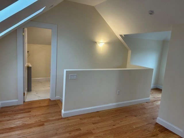 1599 Washington Street, Unit 2 Newton, MA 02465 - Photo 27 of 34 wooden floor in an empty room
