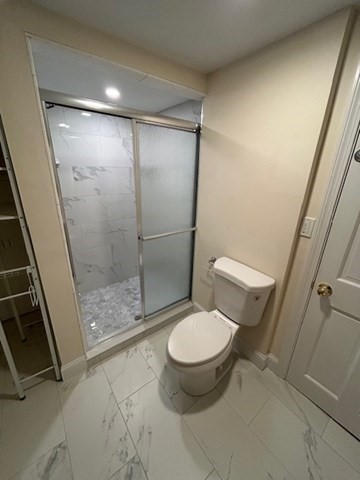 1599 Washington Street, Unit 2 Newton, MA 02465 - Photo 29 of 34 a bathroom with a toilet and a shower