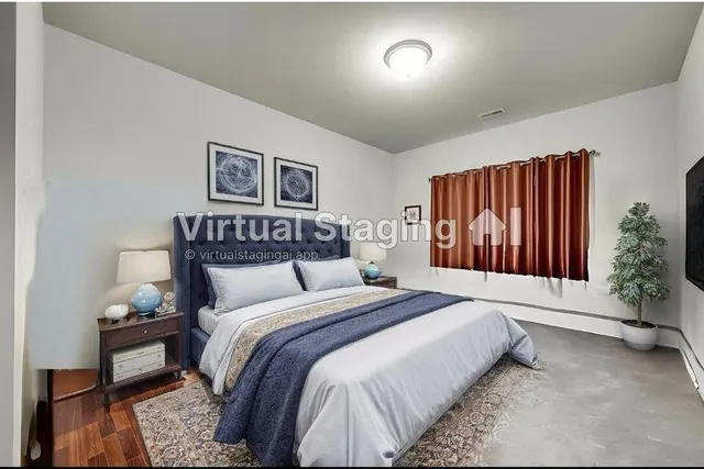 a bedroom with a bed and a dresser