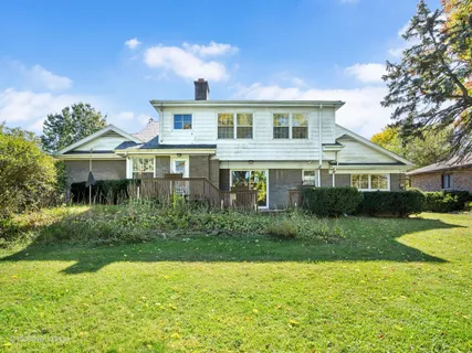 a view of outdoor space with deck and yard